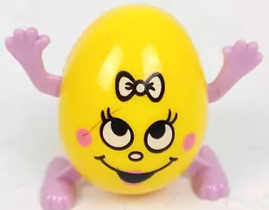 Easter Unlimited Wind-Up Egg Side Shuffles 2 1/4" Yellow Girl w Purple Hand Feet - Picture 1 of 5