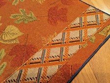 Table mats, fall leaves on the brown with the ribbon on one side, 18x 12 in