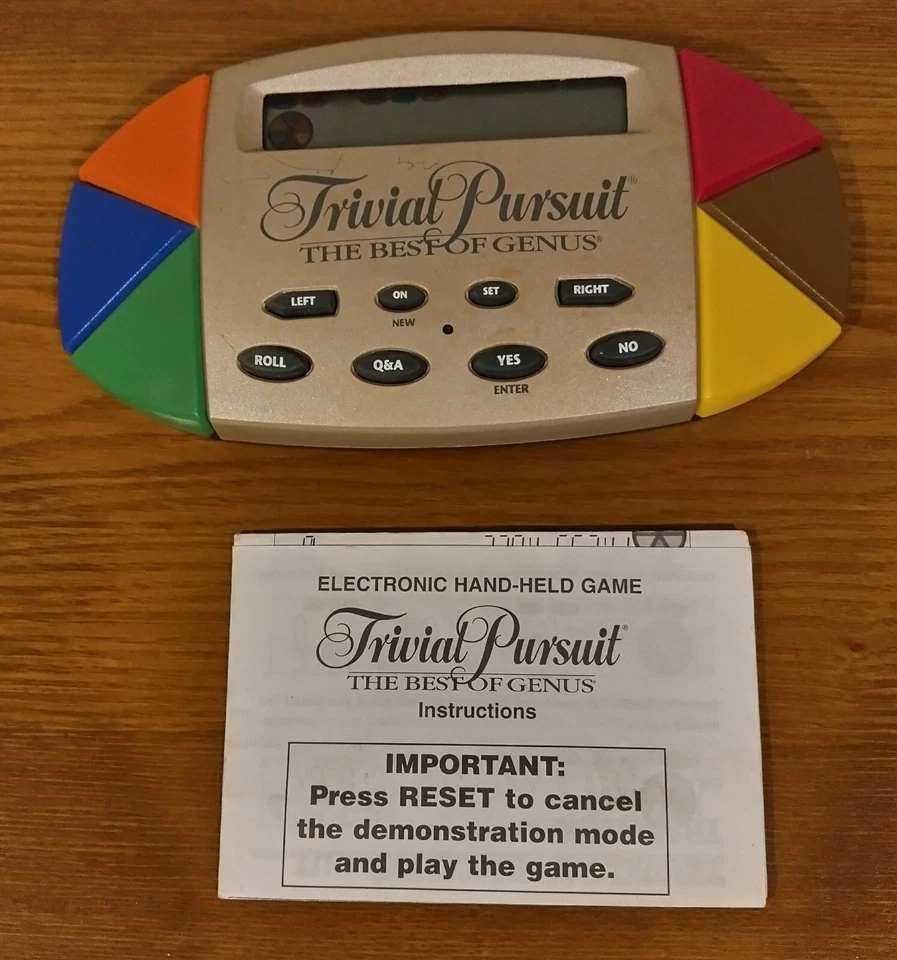 Trivial Pursuit The Best of Genus Electronic Handheld Game 1997 WITH MANUAL - Image 1 of 1