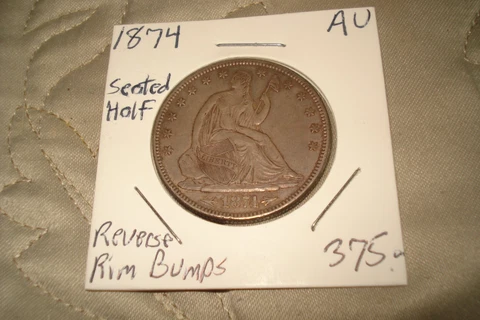1874 SEATED LIBERTY HALF DOLLAR WITH ARROWS - AU WITH REVERSE RIM BUMPS Cover