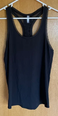 Camiseta sin mangas Fabletics Mosa para mujer pequeña negra espalda deportiva suelta para correr Foto 1 de 4