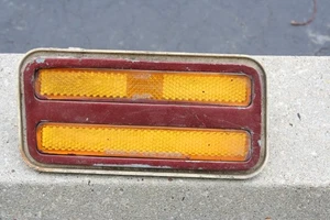 1974-81  PONTIAC FIREBIRD TRANS AM YELLOW  MARKER LIGHT & MOUNTIN BEZZEL  LEFT - Picture 1 of 3