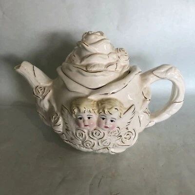 Tetera Querubín 3D Cara de Ángel Rosa Blanca Importaciones AAA Porcelana Coleccionable Foto 1 de 4