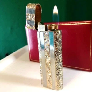 Encendedor Cartier revisado grabado oro plata - Imagen 1 de 10