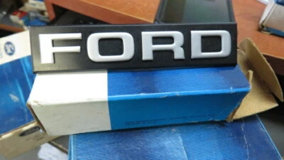 NOS 1981 1982 FORD ESCORT FRONT GRILL GRILLE EMBLEM NAMEPLATE E1FZ-8A223-A NEW - Image 1 of 2