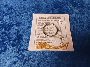 RING ON CHAIN CLOSE UP MAGIC TRICK COMPLETE WITH RING AND GOLD COLORED CHAIN - Picture 1 of 1