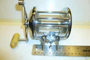 Penn Long Beach 68 WITH NEWELL TEFLON BUSHING 66 SIDEPLATE. SLIGHTLY USED - Picture 1 of 5