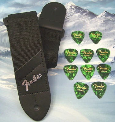 CORREA DE GUITARRA ~ GUARDABARROS GENUINO ~ NEGRO con LOGO PLATEADO + 10 PÚAS 351 VERDES MEDIANAS Foto 1 de 2