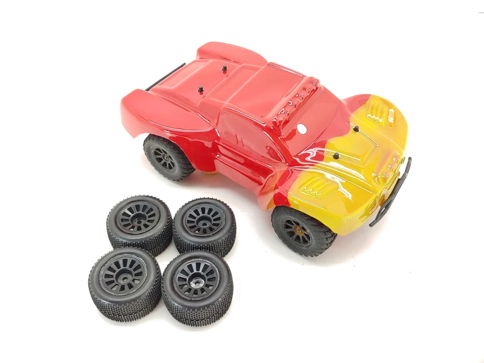 Dromida DT4.18 1/18 Scale Mini Short Course Truck ARTR w/ Extra Tires No Remote - Image 1 of 4