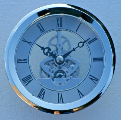 Skeleton Clock 103mm diameter quartz insertion, silver finish.  - Image 1 of 3