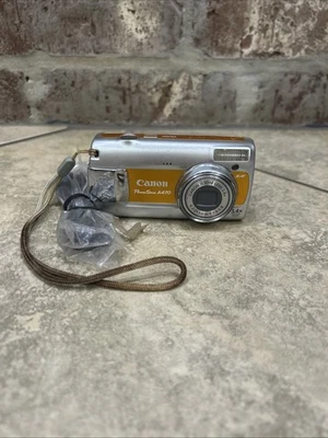 Cámara digital Canon PowerShot A470 7,1 MP - naranja - probada Foto 1 de 4