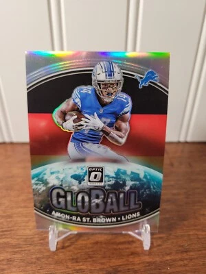 2021 Donruss Optic Amon-Ra St Brown GloBall Silver Prizm Rookie RC #GB-3 Lions - Image 1 of 2