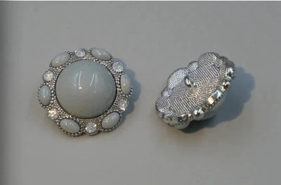 4 Vintage-style metal buttons with a glossy cabochon center and ornate edges.10 - Image 1 of 4