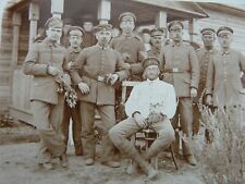 Company of German Soldiers with some weary looking men. See scan