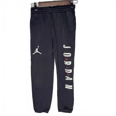Pantalones deportivos Air Jordan juveniles medianos 10-12 negros/rojos baloncesto escolar Foto 1 de 4