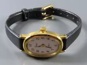 TIMEX WRIST WATCH Gold Tone Oval BLACK LEATHER BAND Cream Dial LADIES New Batt - Picture 1 of 4