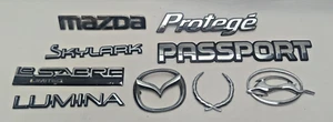 Lote emblema puerta GENUINO Mazda Skylark Protege Lumina Le Sabre - Imagen 1 de 4