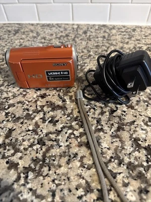 Sony MHS-CM1 HD Webbie Camcorder Orange 5.0 Mega Pixels 5X Optical Charger - Image 1 of 3