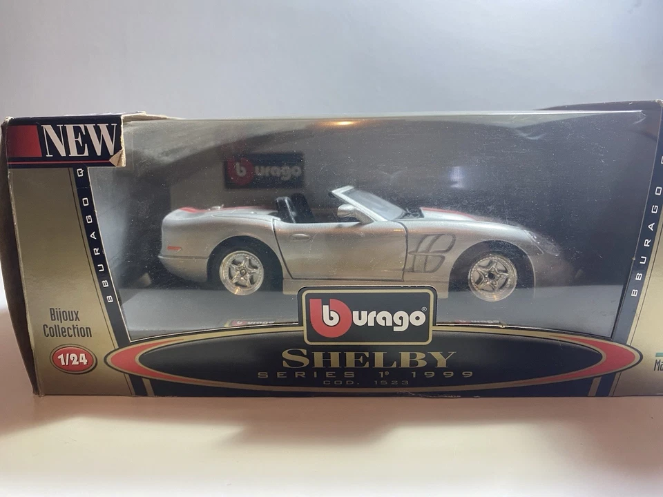 Coche modelo diecast Shelby serie 1 1998 escala 1 Burago Foto 1 de 3