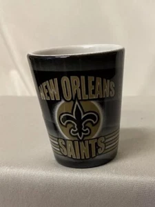 #654 New Orleans Saints Logo Shot Glass - Ceramic Gold And Black - NFL - Picture 1 of 6