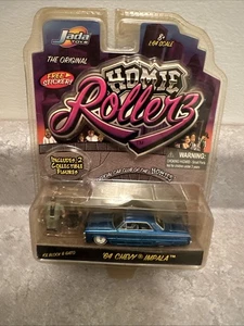 JADA TOYS HOMIE ROLLERS 1964 CHEVY IMPALA CON BLOQUE DE HIELO Y GATO COMO NUEVO EN TARJETA, ¡Nuevo! - Imagen 1 de 7