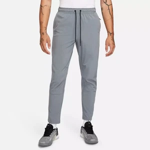Hombres Talla’ M- Nike Unlimited Pierna Cónica Pantalones Versátiles Gris FB7546-084 - Imagen 1 de 6