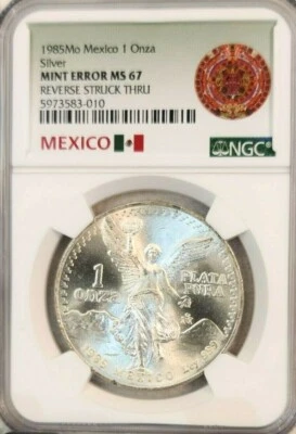 1985 MEXICO SILVER LIBERTAD 1 ONZA NGC MS 67 MINT ERROR REVERSE STRUCK THROUGH - Image 1 of 4
