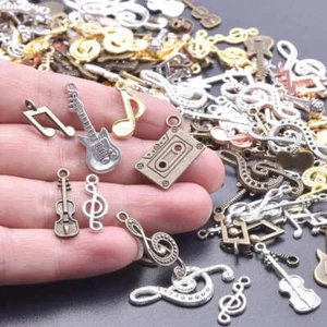 50pcs vintage music charms with guitar, violin, and microphone for DIY jewelry. - Picture 1 of 7
