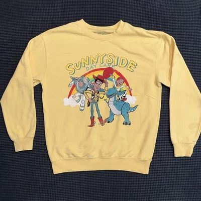 Disney Pixar Story Story Sunnyside Daycare Crewneck Sweatshirt Yellow Medium - Image 1 of 4