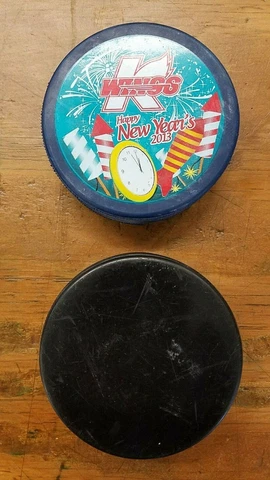 Kalamazoo Wings Hockey Pucks - Happy New Year and Black Game Puck - Used - #4A6 Cover
