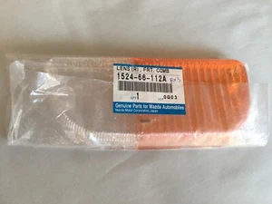 MAZDA RX3 808 RIGHT HAND FRONT BUMPER PARK LIGHT LENS ORANGE CLEAR GENUINE NOS - Picture 1 of 5