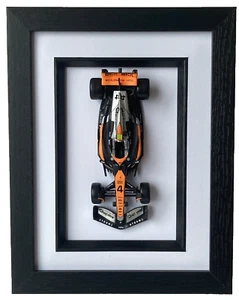 Bburago 1/43 F1 Mclaren MCL60 #4 Lando Norris 2023 model in a black frame #38087 - Picture 1 of 6