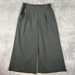 Yoga Caprihose Damen M weites Bein verkürzt Reißverschluss Taschen Stretch Freizeit grün gebraucht, in einwandfreiem Zustand - Bild 1 von 11