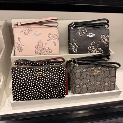 Muñequera Coach Corner Cremallera Brillante Estampado Mariposa CCJ72 CCL22 CCJ71 Foto 1 de 4