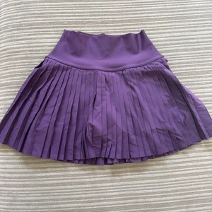 Falda Tenis Alo Grand Slam Púrpura W6289r XS - Imagen 1 de 2