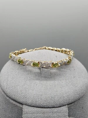 FAS 签名绿色 Peridot 水钻纯银 7 英寸 XX 网球手链 — 第 1/4 张图片