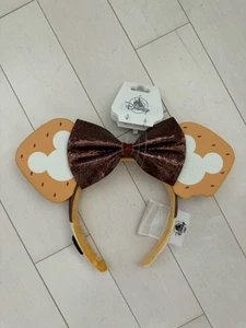 Cerchietto orecchie Disney Parks Eats Collection S’mores Minnie marrone fiocco Smores - Foto 1 di 2