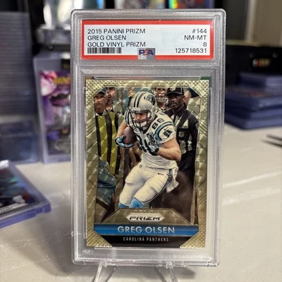 2015 Panini Prizm Greg Olsen #144 Gold Vinyl Prizm /5 Carolina Panthers PSA 8 - Image 1 of 2