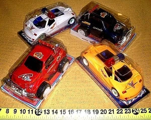 4 TOY VEHICLES 2 JEEP BIG WHEELS/2 POLICE CARS/NEW IN PACKAGES - Picture 1 of 1