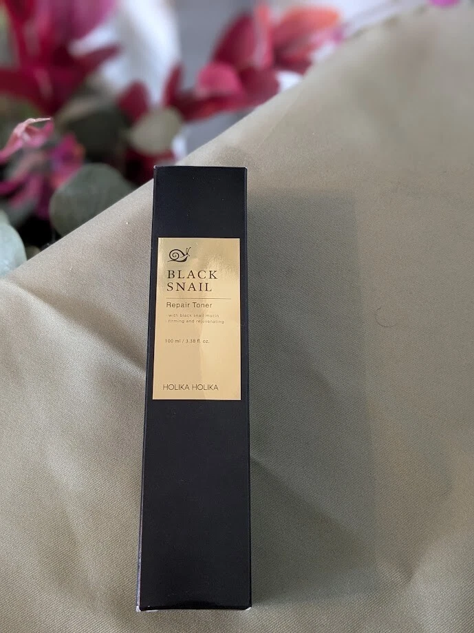 Tónico reparador de caracoles negros Holika Holika 3,38 fl oz - líquido hidratante para rostro  Foto 1 de 4