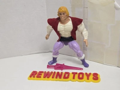 Figura De Colección MOTU He Man Prince Adam Masters Of The Universe TIENE DESGASTE Foto 1 de 4