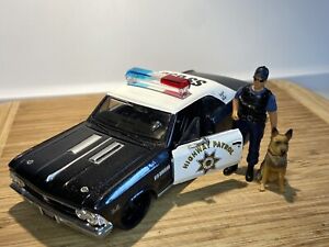 Maisto 1:24  CHP Chevrolet Chevelle SS With Officer,K9 ,RARE Car Has Black Rims.