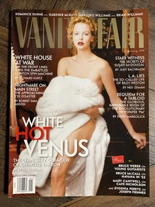 CHARLIZE THERON - VANITY FAIR Magazine - January 1999 - Y2K / Clintons - Picture 1 of 4
