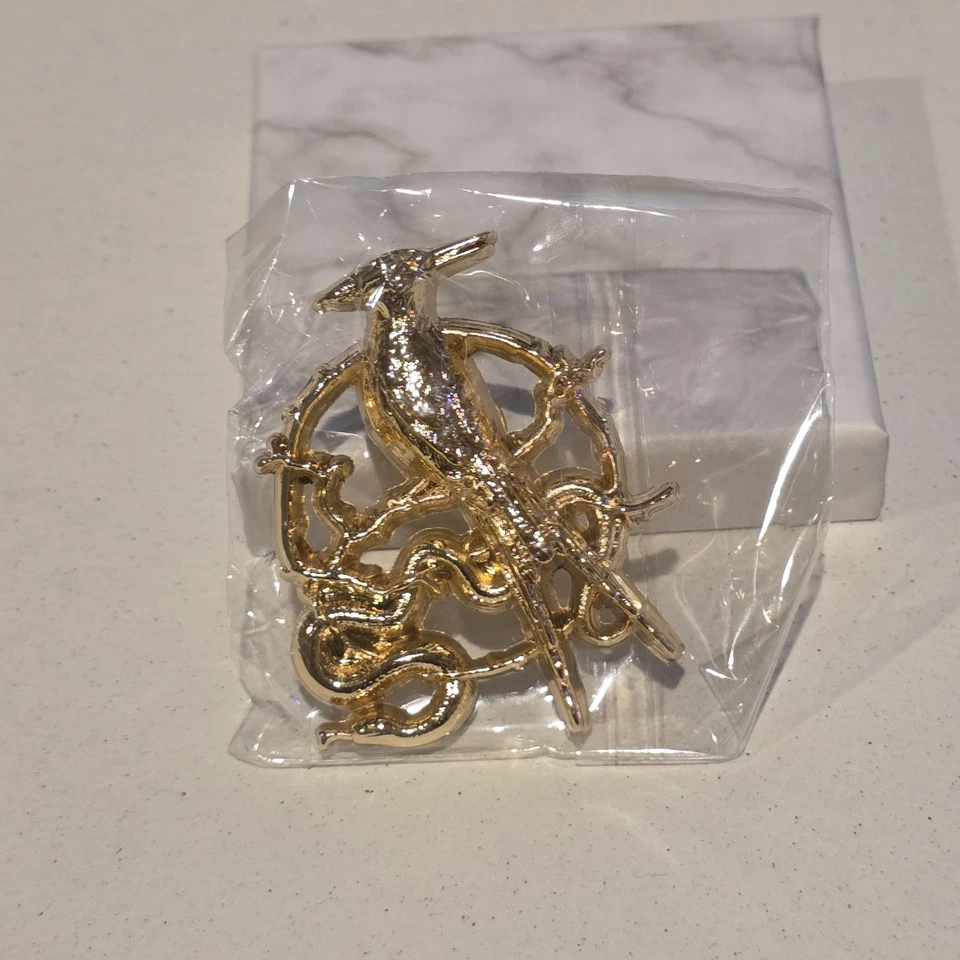 The Hunger Games: The Ballad of Songbirds & Snakes Lapel Pin New In Box - Image 1 of 3