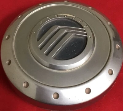 UNA TAPA CENTRAL CROMADA MECANIZADA MERCURY MOUNTAINEER 3L24-1A096-DA USADA 6455 Foto 1 de 3