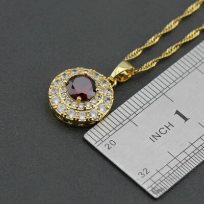 ANHÄNGER + KETTE AUS GOLDFIELD MIT RUBINROTEM ZIRKONIA. - Bild 1 von 2