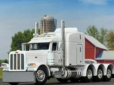 1/64 DCP WHITE PETERBILT 389 TRI AXLE W/ 63" MID ROOF SLEEPER W/ WHALE TAIL - Image 1 of 4
