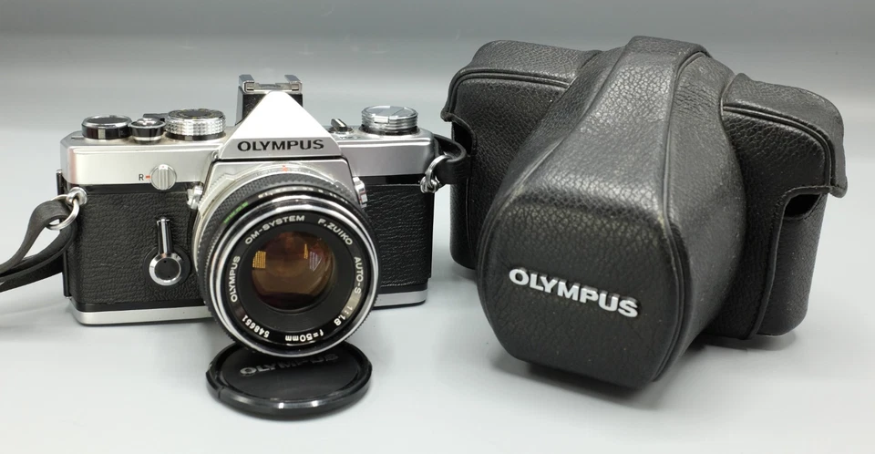 OLYMPUS OM-1 SLR w Zuiko 1.8/50 Near MINT w Case + User Manual - Image 1 of 4