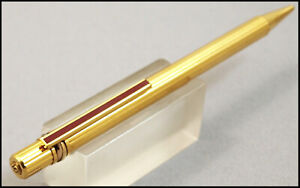GOLD AND CHINA LACQUER MUST OF CARTIER TRIPLE RING BALLPOINT PEN