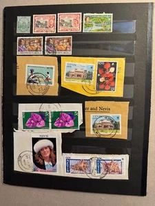 St Kitts-Nevis/Nevis group of 26 stamps loose Scott Cat 12a/211, 258a-b/648Ab - Picture 1 of 3